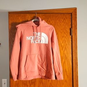 North Face women's hooded sweatshirt,  size medium,  a light pink/peach color.
